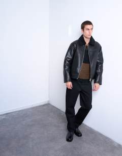 Model wearing Faux shearling jacket with zip pockets in black