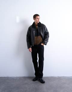 Model wearing Faux shearling jacket with zip pockets in black