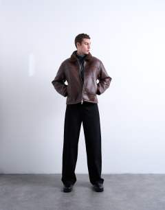 Model wearing Faux shearling jacket with zip pockets in brown