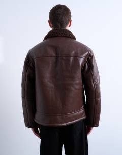 Model wearing Faux shearling jacket with zip pockets in brown