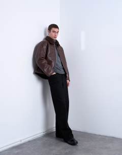 Model wearing Faux shearling jacket with zip pockets in brown