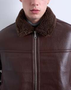 Model wearing Faux shearling jacket with zip pockets in brown