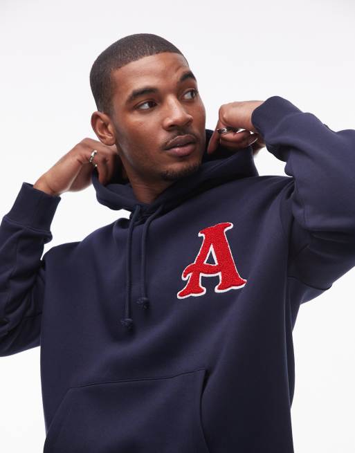 Topman - Felpa oversize color blu navy con cappuccio e lettera ricamata in ciniglia