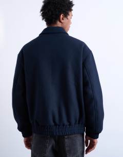 Model wearing Fireman clasp wool blend jacket in navy