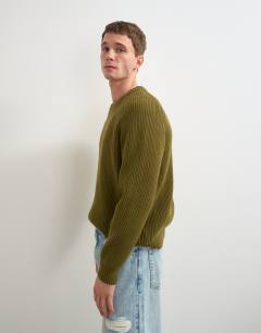 Model wearing Fisherman rib knitted jumper in khaki