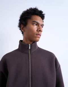 Model wearing Funnel neck zip through panel sweatshirt in brown