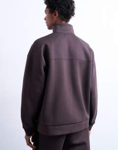Model wearing Funnel neck zip through panel sweatshirt in brown