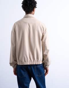 Model wearing Harrington jacket in stone