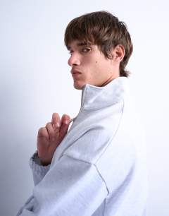 Model wearing Heavyweight boxy fit zip through funnel neck sweatshirt in light grey marl