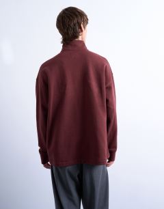Model wearing Heavyweight oversized fit 1/4 zip in brown