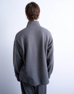 Model wearing Heavyweight oversized fit 1/4 zip in charcoal