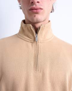 Model wearing Heavyweight oversized fit 1/4 zip in dark stone