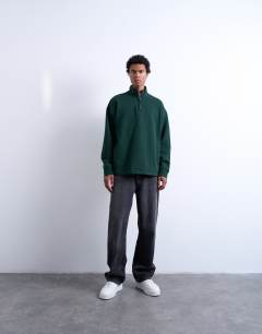 Model wearing Heavyweight oversized fit 1/4 zip in pine green