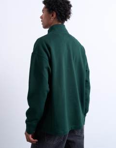 Model wearing Heavyweight oversized fit 1/4 zip in pine green