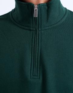 Model wearing Heavyweight oversized fit 1/4 zip in pine green