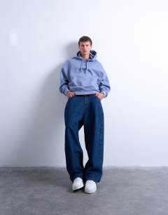 Model wearing Heavyweight oversized fit hoodie in mid blue