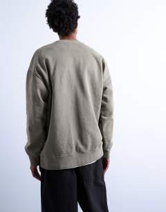 Model wearing Heavyweight oversized fit sweatshirt in washed khaki
