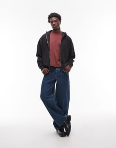 Model wearing Heavyweight oversized fit zip through hoodie in black