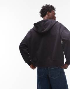 Model wearing Heavyweight oversized fit zip through hoodie in black