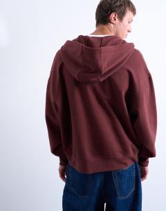 Model wearing Heavyweight oversized fit zip through hoodie in brown