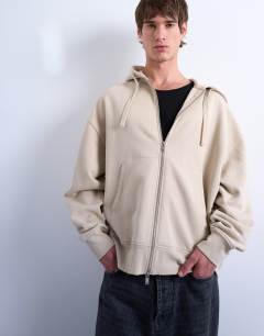Model wearing Heavyweight oversized fit zip through hoodie in light stone