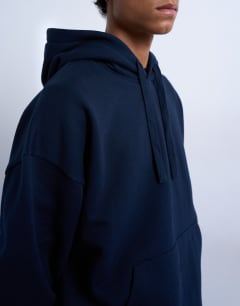 Model wearing Heavyweight oversized hoodie in navy