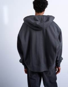 Model wearing Heavyweight oversized zip through hoodie in charcoal
