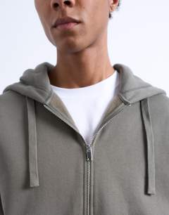 Model wearing Heavyweight oversized zip through hoodie in olive