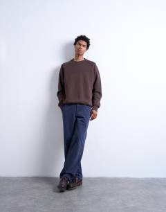 Model wearing Heavyweight raglan sweatshirt with raw seam in brown
