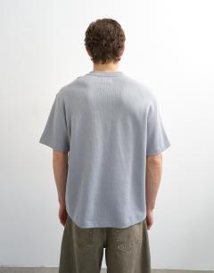 Model wearing Heavyweight relaxed fit henley t-shirt in grey