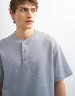 Model wearing Heavyweight relaxed fit henley t-shirt in grey