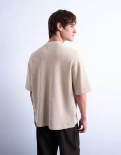 Model wearing Heavyweight waffle crop fit t-shirt in stone