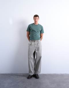 Model wearing Herringbone barrel trouser in stone
