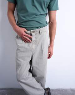Model wearing Herringbone barrel trouser in stone