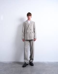 Model wearing Herringbone double breasted blazer in stone