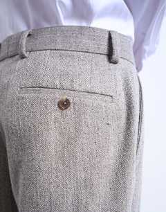 Model wearing Herringbone relaxed trousers in stone