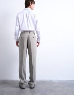 Model wearing Herringbone relaxed trousers in stone
