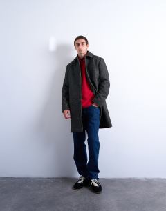 Model wearing Herringbone wool blend overcoat in black