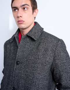 Model wearing Herringbone wool blend overcoat in black