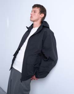 Model wearing Hooded short zip up jacket in black