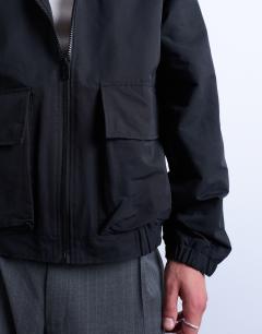 Model wearing Hooded short zip up jacket in black