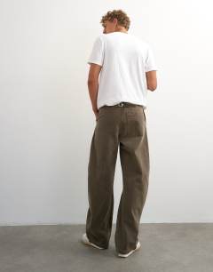 Model wearing Horseshoe barrel fit canvas trouser in khaki