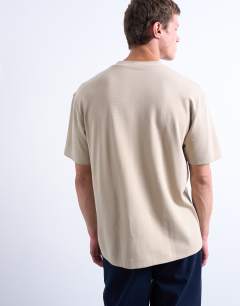 Model wearing Interlock oversized fit t-shirt in stone