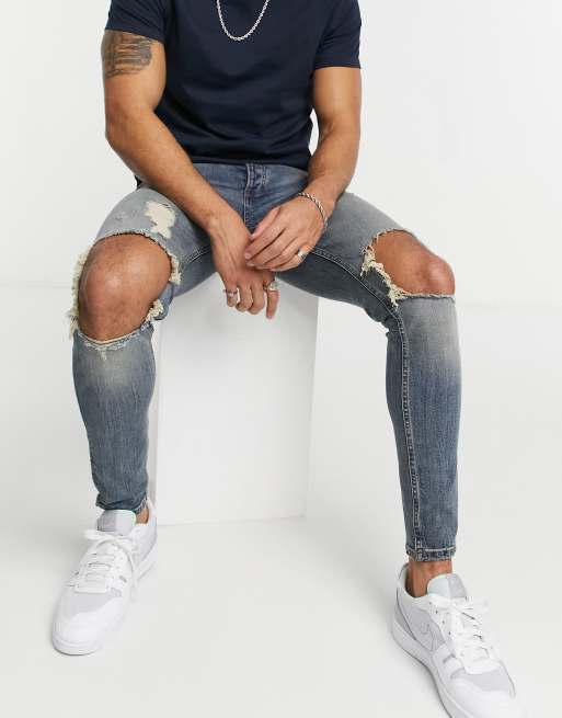 Topman - Jeans in misto cotone lavaggio medio effetto spray on con strappi - MBLUE