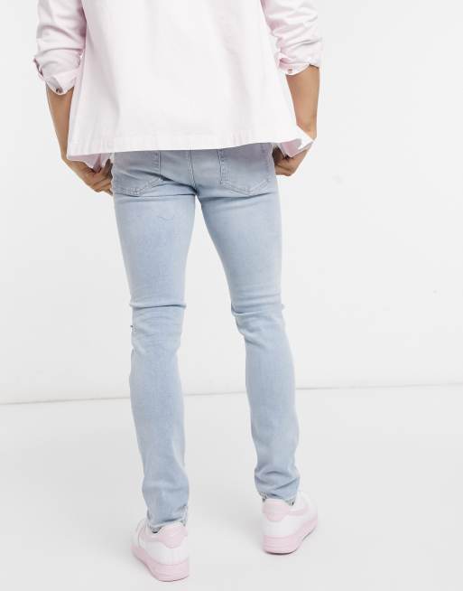 Topman - Jeans skinny in misto cotone elasticizzato lavaggio candeggiato con strappi alle ginocchia - MBLUE, 2 di 4