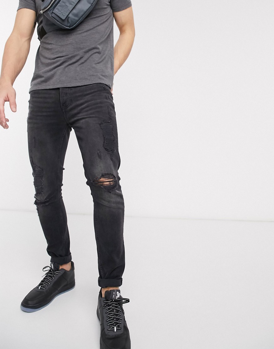 Topman - Jeans skinny in tessuto organico nero slavato con strappi