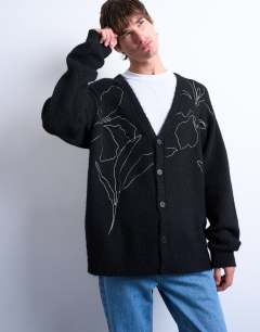 Model wearing Knitted cardigan with floral embroidery in black