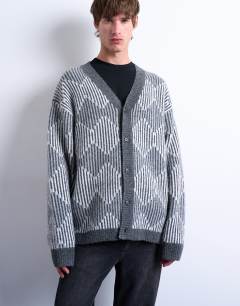 Model wearing Knitted diamond cardigan in grey