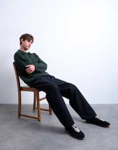 Model wearing Knitted smart polo jumper in dark green