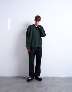 Model wearing Knitted smart polo jumper in dark green